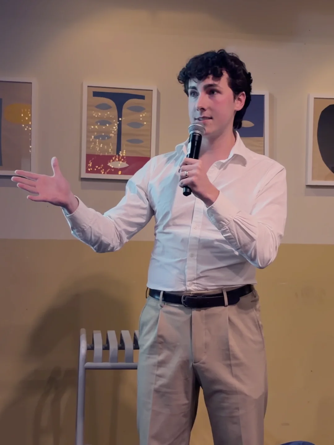 Michael speaking with a microphone at a campaign event